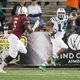 Quarterback Greg Windham of the Ohio Bobcats scrambles by defensive end Sam Lebbie of the Troy Trojans in the Dollar General Bowl. (Photo: Michael Chang/Getty Images)